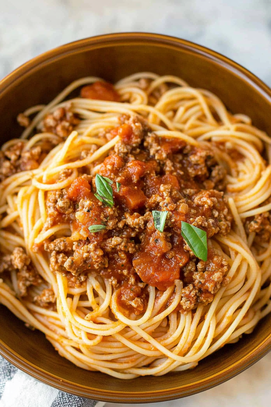 Draining cooked spaghetti noodles